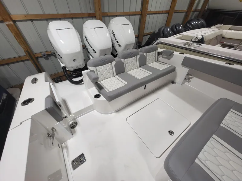 Slide: The Image of 2022 Fountain 38 SC boat with triple outboard engines and spacious seating. - 9