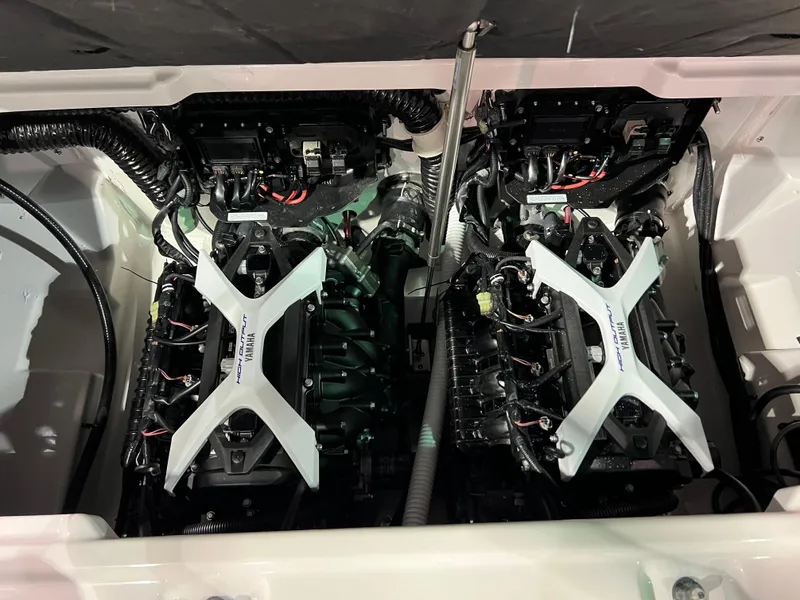 Slide: The Image of 2025 Yamaha AR250 boat engine compartment with dual engines and wiring. - 10
