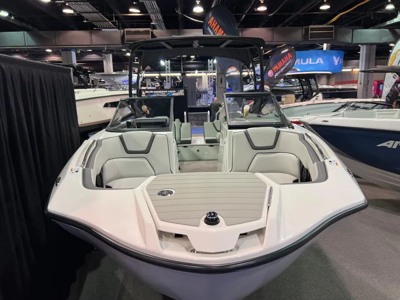 Slide: The Image of 2025 Yamaha AR250 boat displayed at an indoor boat show. - 2