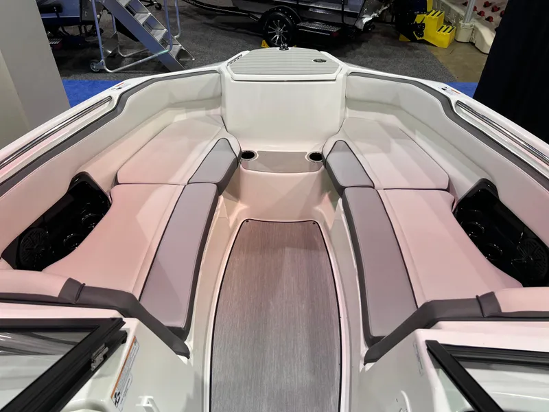 Slide: The Image of 2025 Yamaha Boats AR250 interior with spacious seating and modern design. - 8