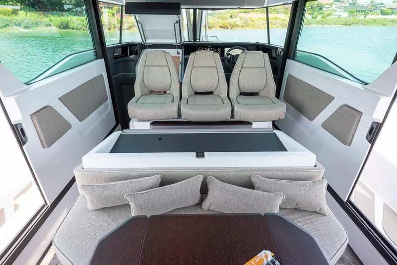Slide: The Image of Luxurious interior of 2025 Axopar 45 boat with plush seating and modern design. - 5