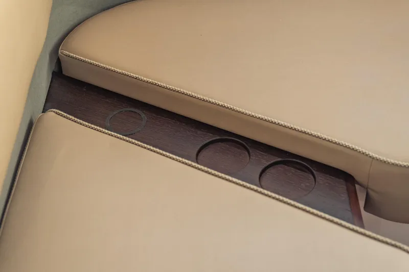Slide: The Image of Luxurious beige seating with cup holders in 2025 Axopar 45 XC Cross Cabin. - 48