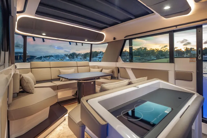 Slide: The Image of Luxurious interior of 2025 Axopar 45 XC Cross Cabin with modern seating and scenic views. - 37