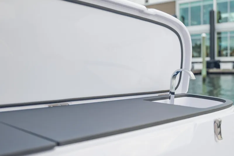 Slide: The Image of 2025 Axopar 45 XC Cross Cabin boat sink detail with sleek design. - 27