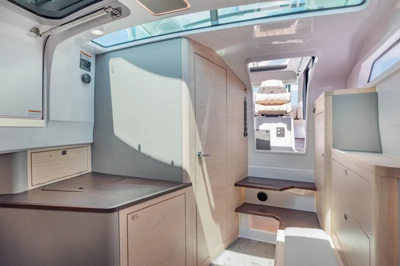 Slide: The Image of Interior of 2025 Axopar 45 XC Cross Cabin, featuring modern design and natural light. - 42