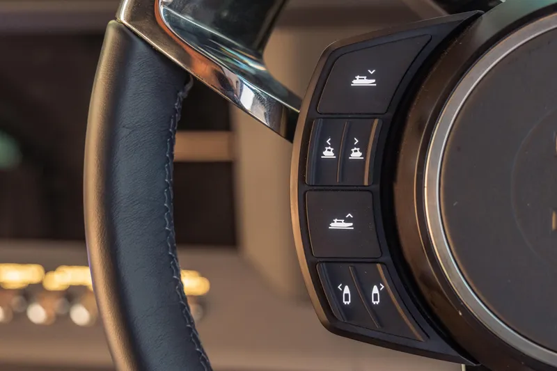 Slide: The Image of Steering wheel controls of 2025 Axopar 45 XC Cross Cabin boat. - 35