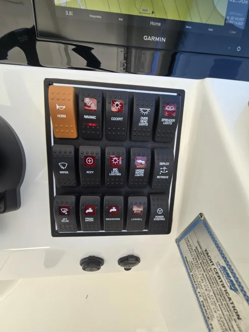 Slide: The Image of Control panel of a 2020 Pursuit 266 boat with Garmin display. - 16
