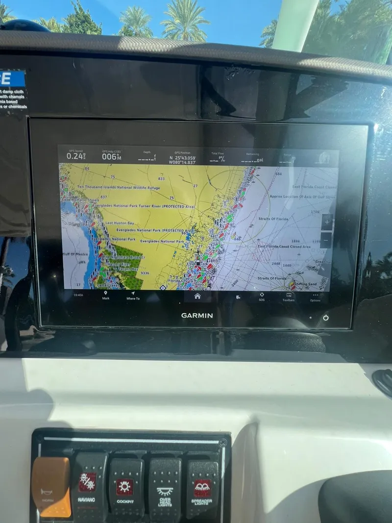 Slide: The Image of Garmin navigation display on 2020 Pursuit 266 boat, showing detailed marine map. - 18