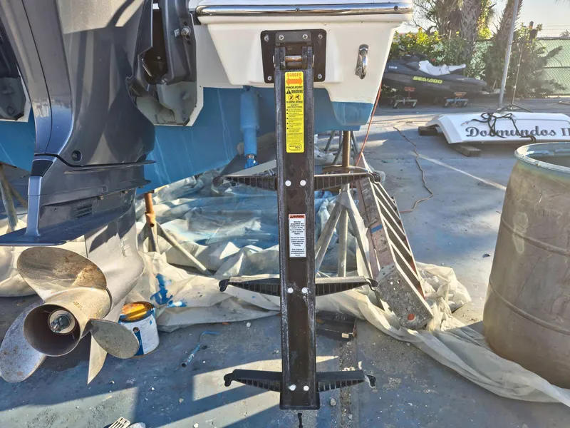 Slide: The Image of Pursuit 266 boat maintenance with propeller and support stand, 2020 model. - 6