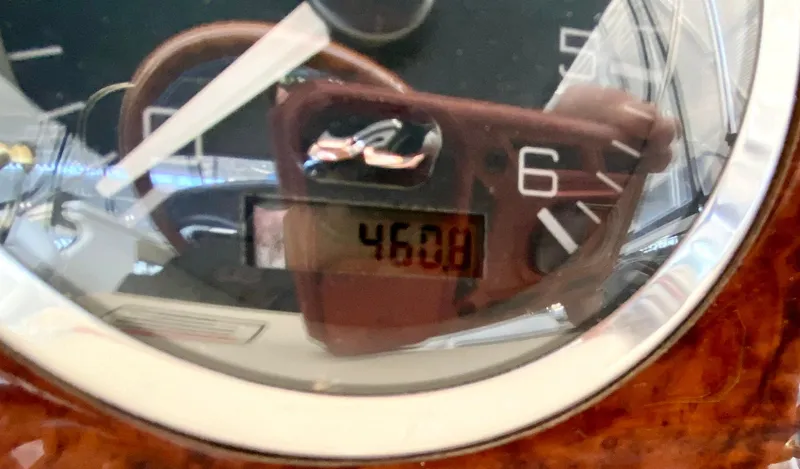 Slide: The Image of Close-up of a 2001 Sea Ray 380 Aft Cabin gauge displaying 460.8 hours. - 11