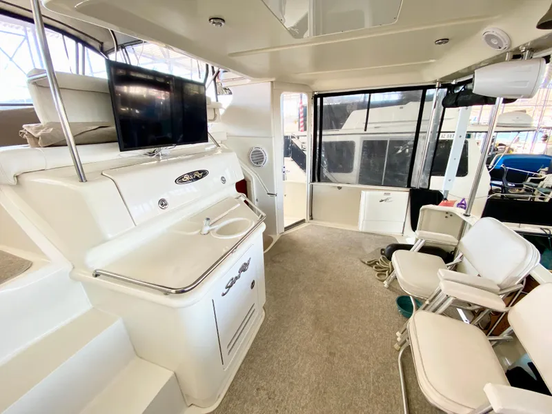 Slide: The Image of Interior of 2001 Sea Ray 380 Aft Cabin yacht with seating and TV. - 14