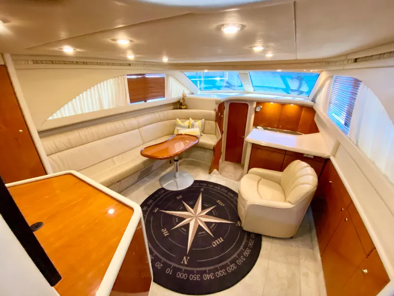 Slide: The Image of Luxurious interior of 2001 Sea Ray 380 Aft Cabin yacht with plush seating and elegant decor. - 15