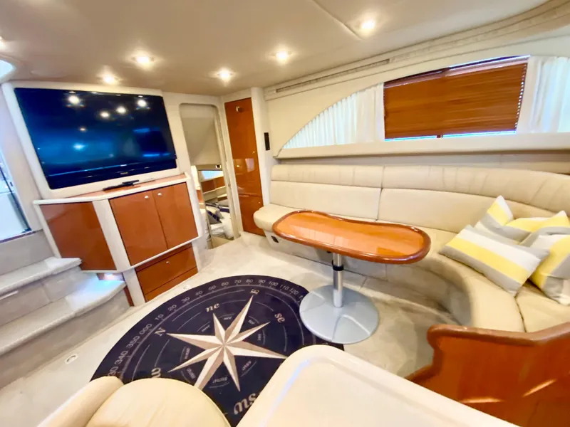 Slide: The Image of Luxurious 2001 Sea Ray 380 Aft Cabin interior with plush seating and modern amenities. - 16