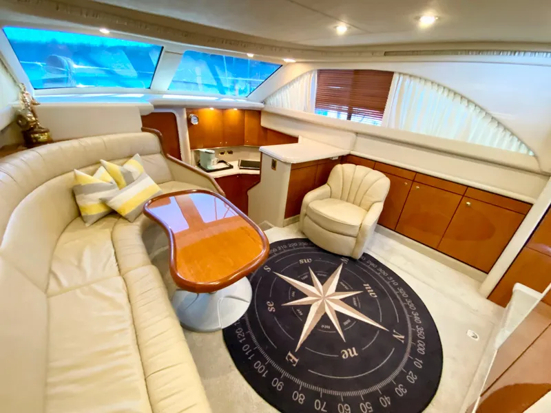 Slide: The Image of Luxurious 2001 Sea Ray 380 Aft Cabin interior with plush seating and elegant decor. - 17