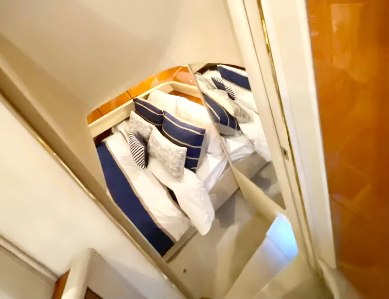 Slide: The Image of Luxurious cabin interior of 2001 Sea Ray 380 Aft Cabin yacht with plush bedding. - 29