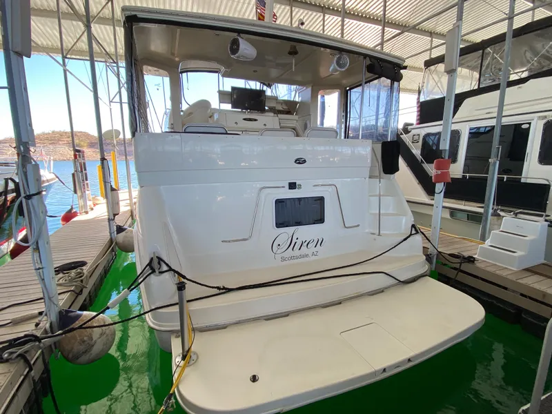Slide: The Image of 2001 Sea Ray 380 Aft Cabin yacht docked in a marina. - 3