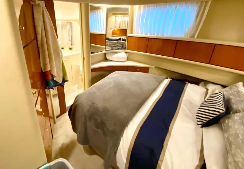 Slide: The Image of Cozy bedroom in 2001 Sea Ray 380 Aft Cabin yacht with modern decor. - 31