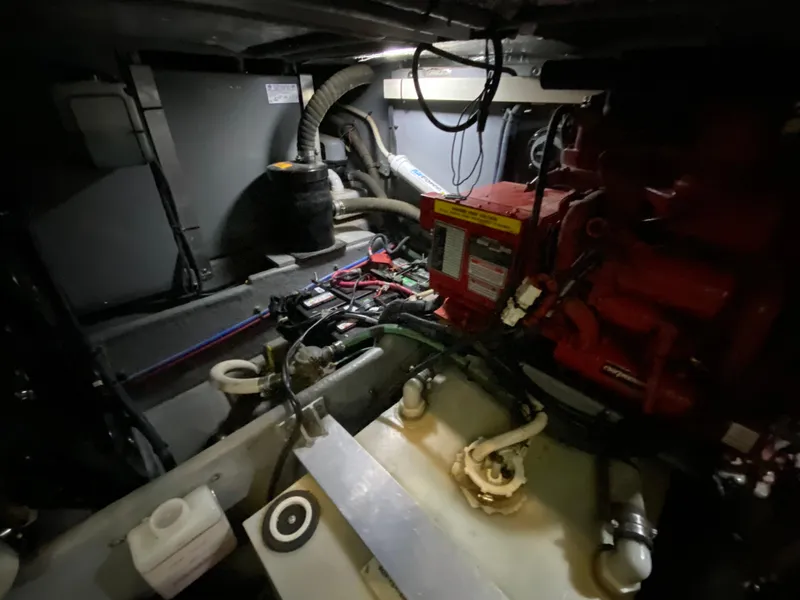 Slide: The Image of Engine room of 2001 Sea Ray 380 Aft Cabin with visible machinery and wiring. - 36