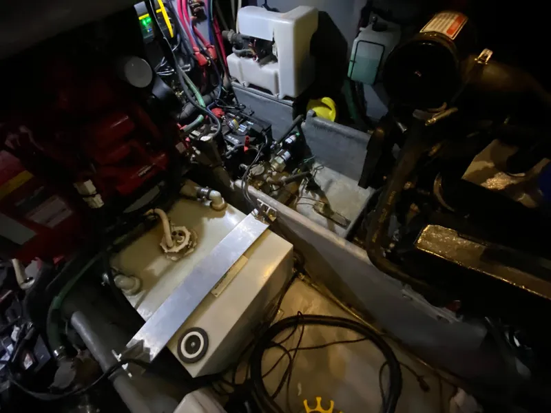 Slide: The Image of Engine room of 2001 Sea Ray 380 Aft Cabin with visible machinery and components. - 37