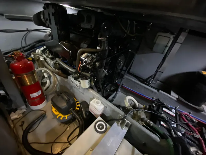 Slide: The Image of Engine room of 2001 Sea Ray 380 Aft Cabin with visible fire extinguisher and equipment. - 39