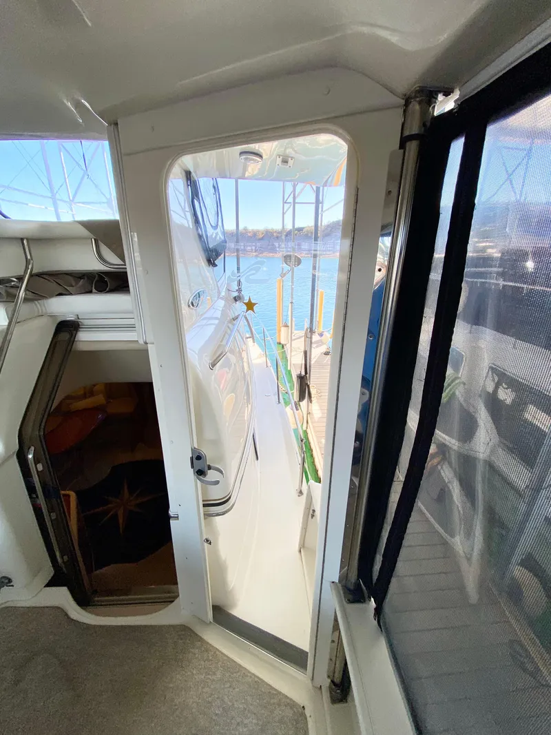 Slide: The Image of Interior view of 2001 Sea Ray 380 Aft Cabin yacht with open door to deck. - 5