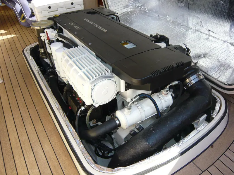 Slide: The Image of Engine compartment of a 1998 Hinckley 36 Classic yacht, showcasing detailed mechanical components. - 27