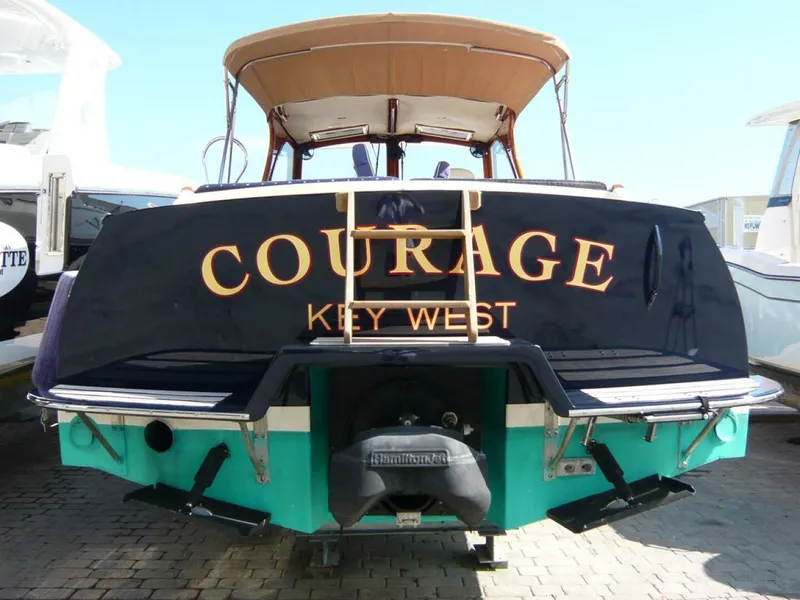 Slide: The Image of Hinckley 36 Classic 1998 boat named "Courage" docked in Key West. - 31