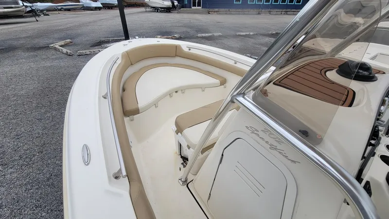 Slide: The Image of 2019 Pioneer 202 Sportfish boat interior with beige seating and console. - 3