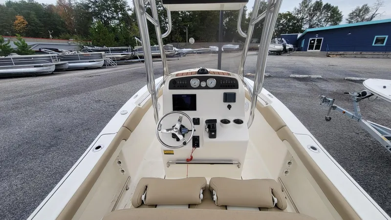 Slide: The Image of 2019 Pioneer 202 Sportfish boat interior with steering wheel and control panel. - 6