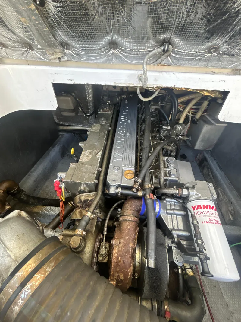 Slide: The Image of Engine compartment of a 2000 Mainship Pilot 34 with Yanmar diesel engine. - 30