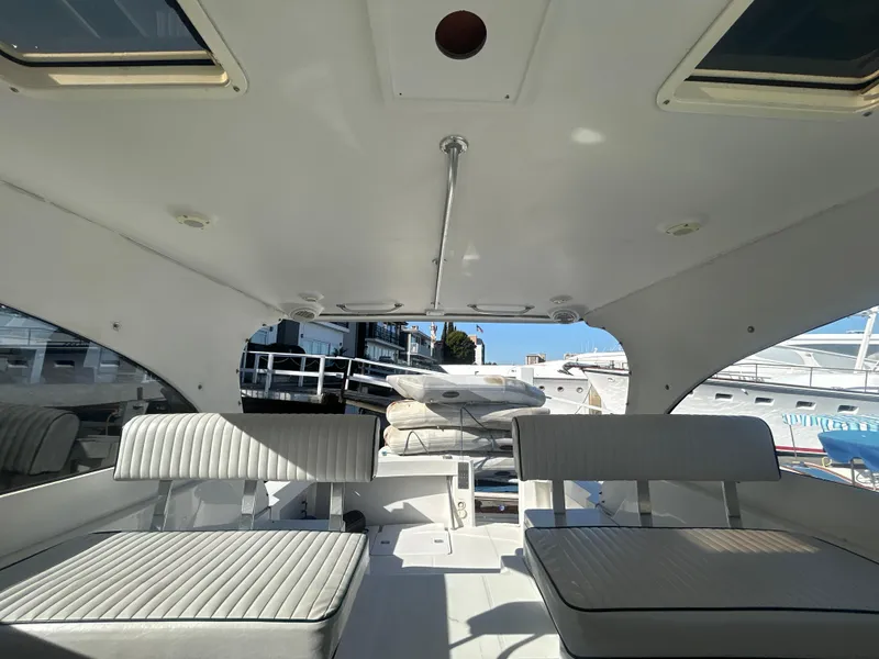 Slide: The Image of Interior view of 2000 Mainship Pilot 34 boat with seating and open deck. - 7