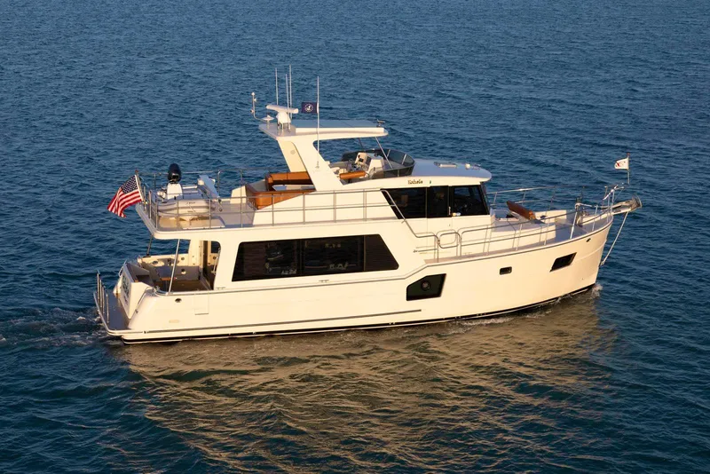 Slide: The Image of 2021 North Pacific 49 Euro Pilothouse yacht cruising on calm blue waters. - 0