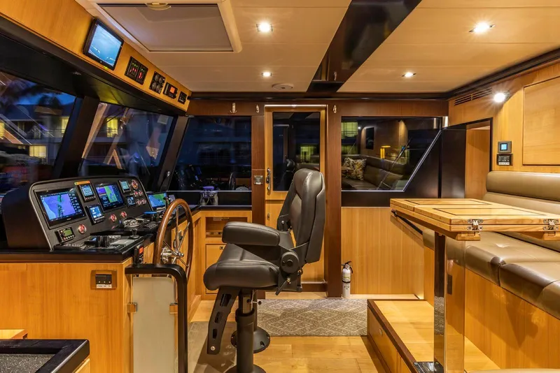 Slide: The Image of Luxurious 2021 North Pacific 49 Euro Pilothouse interior with modern navigation equipment. - 10