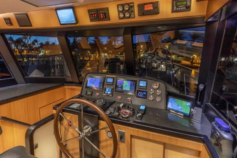 Slide: The Image of Interior view of 2021 North Pacific 49 Euro Pilothouse with advanced navigation equipment. - 11