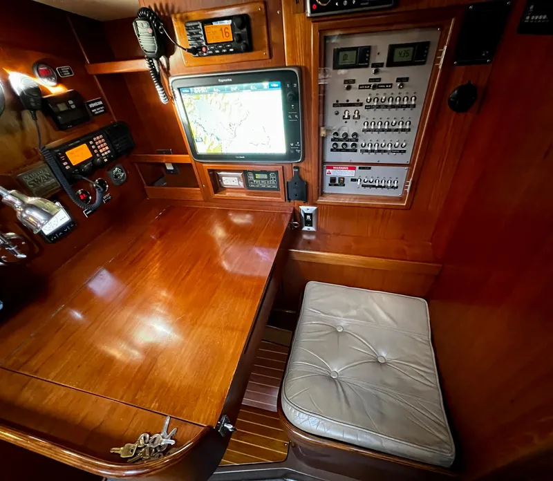 Slide: The Image of Nautor Swan 391 yacht interior, 1984 model, featuring navigation equipment and control panel. - 15