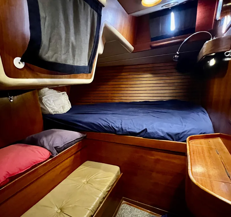Slide: The Image of Cozy cabin interior of 1984 Nautor Swan 391 sailboat with wooden furnishings. - 18