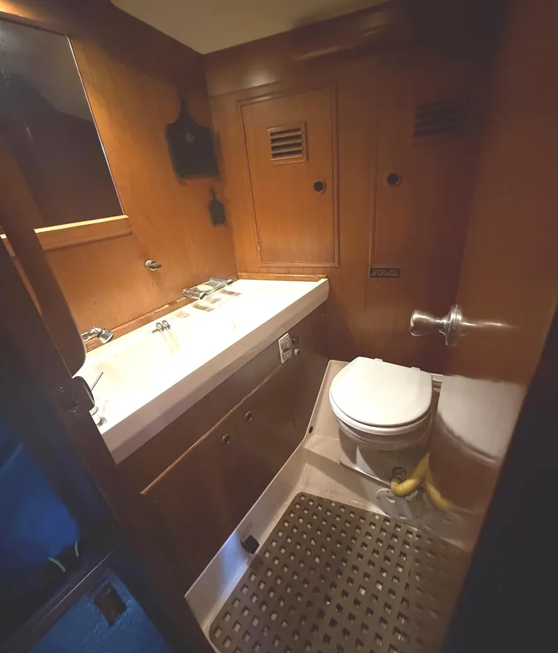 Slide: The Image of 1984 Nautor Swan 391 yacht bathroom with wooden cabinetry and modern fixtures. - 21