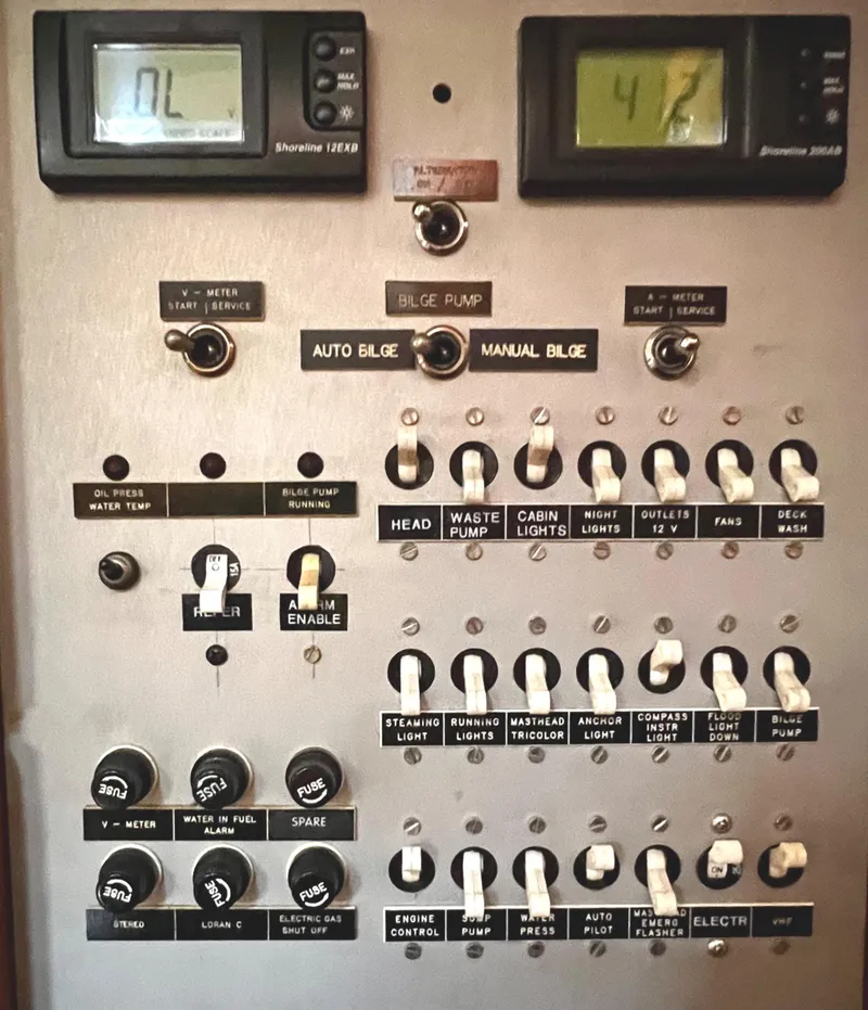 Slide: The Image of Control panel of a 1984 Nautor Swan 391 yacht with switches and digital displays. - 22