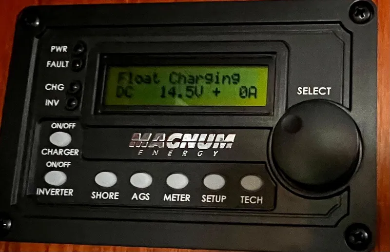 Slide: The Image of Magnum Energy control panel displaying float charging at 14.5V, installed on a 1984 Nautor Swan 391. - 31