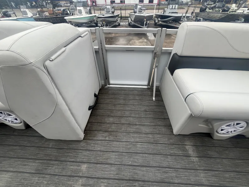 Slide: The Image of 2022 Avalon 2080 VENTURE FNC boat interior with gray seating and flooring. - 11
