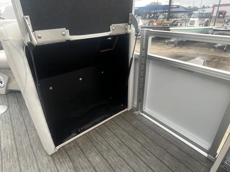 Slide: The Image of Avalon 2080 VENTURE FNC 2022 boat interior storage compartment with open hatch. - 19