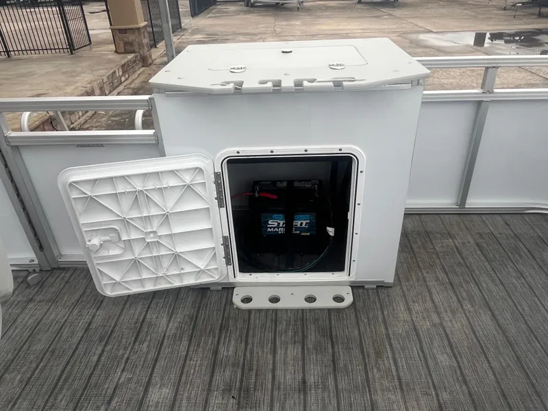 Slide: The Image of Open battery compartment on 2022 Avalon 2080 VENTURE FNC boat. - 22