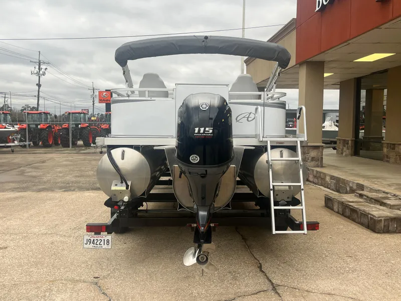 Slide: The Image of 2022 Avalon 2080 VENTURE FNC pontoon boat with Yamaha 115 engine, parked outside dealership. - 7