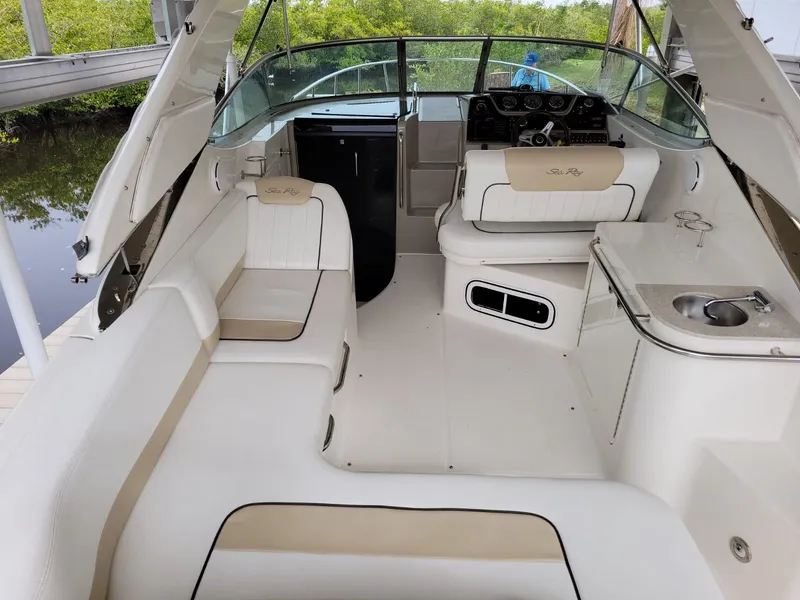 Slide: The Image of 2010 Sea Ray 280 Sundancer boat interior with seating and helm. - 16