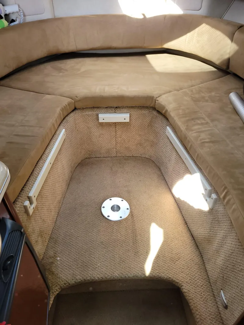 Slide: The Image of Interior cabin of 2010 Sea Ray 280 Sundancer with beige upholstery. - 28