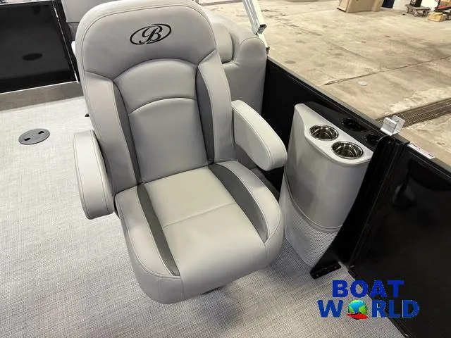 Slide: The Image of 2025 Bentley Pontoons Legacy 200 Navigator Quad Lounge interior with luxury seating and cup holders. - 11