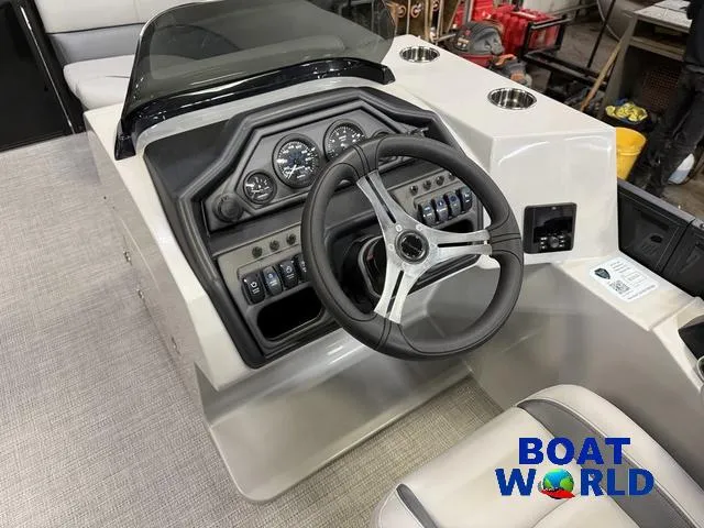 Slide: The Image of 2025 Bentley Pontoons Legacy 200 Navigator Quad Lounge dashboard with steering wheel and controls. - 14