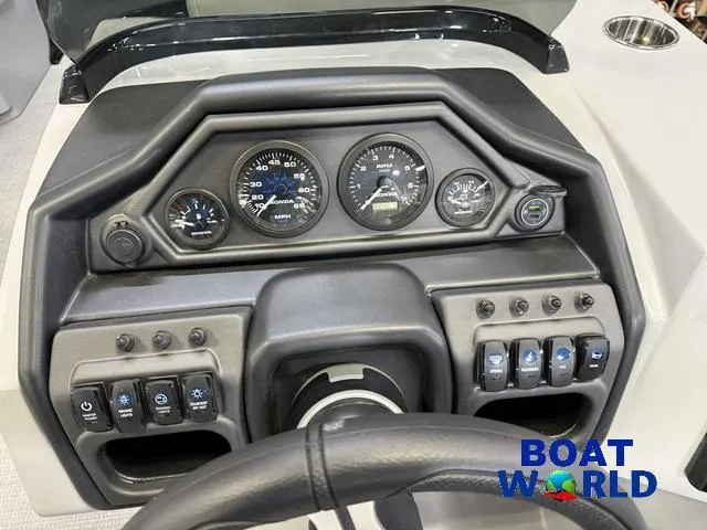 Slide: The Image of Dashboard of 2025 Bentley Pontoons Legacy 200 Navigator with gauges and controls. - 15