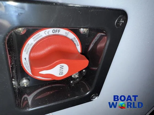 Slide: The Image of Close-up of a red switch on a 2025 Bentley Pontoons Legacy 200 Navigator. - 22