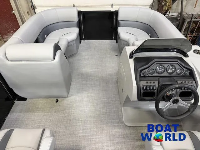Slide: The Image of 2025 Bentley Pontoons Legacy 200 Navigator interior with quad lounge seating and modern helm. - 24